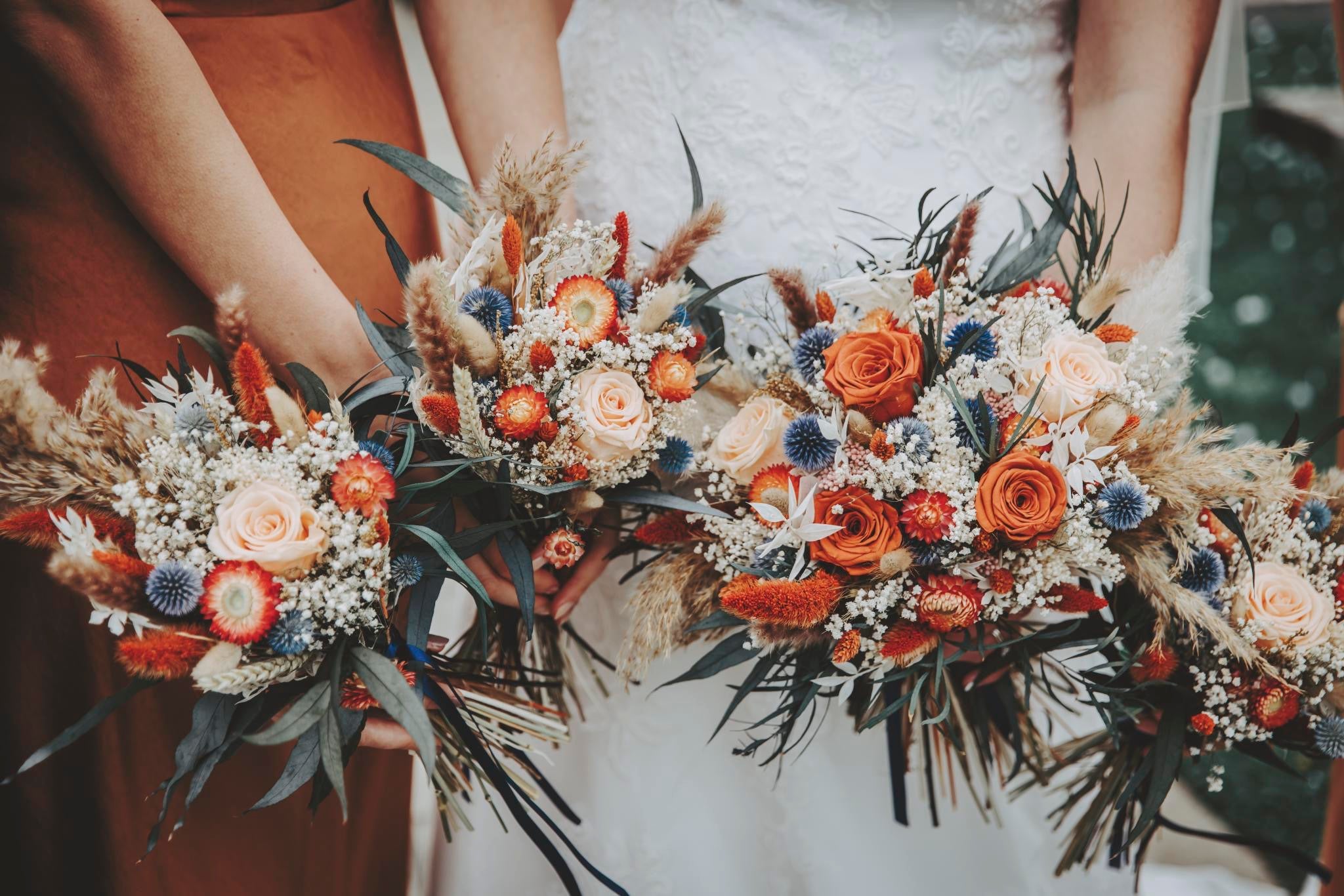Bride holding dried and preserved wedding flowers
